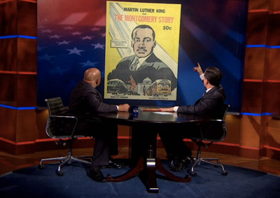 Stephen Colbert points to a copy of the MLK comic book, from EP.TC